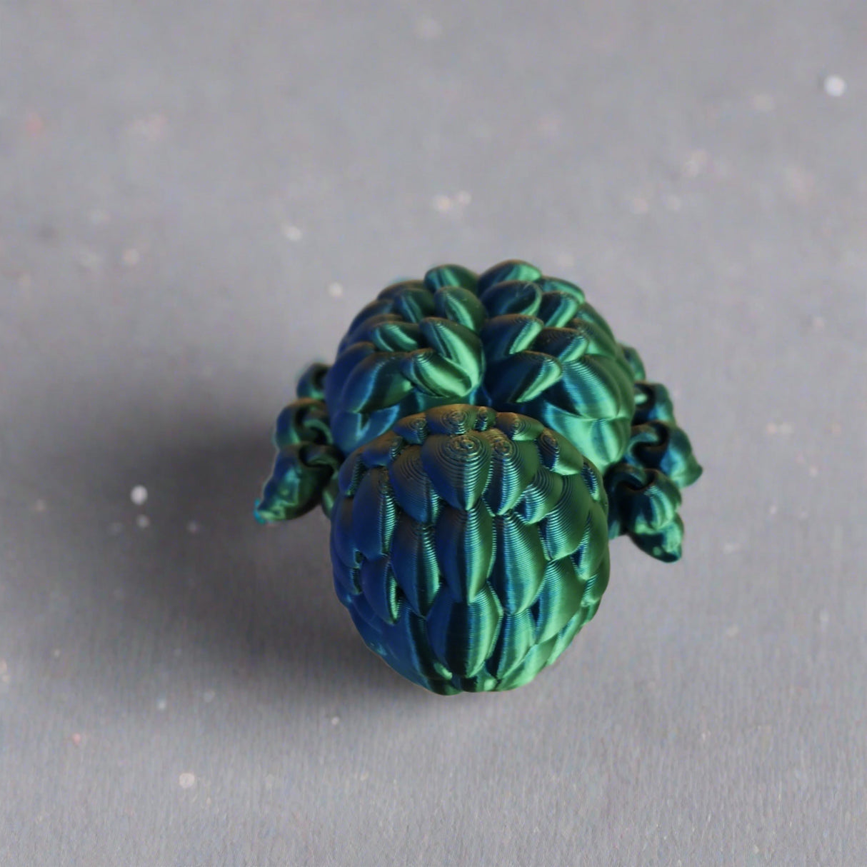 Fidget Spood-Iridescent blue/green Jumping Spider Toy